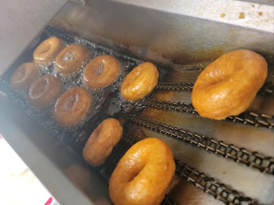 Hot and Fresh Mini-Donuts Coming Out of the Fryer