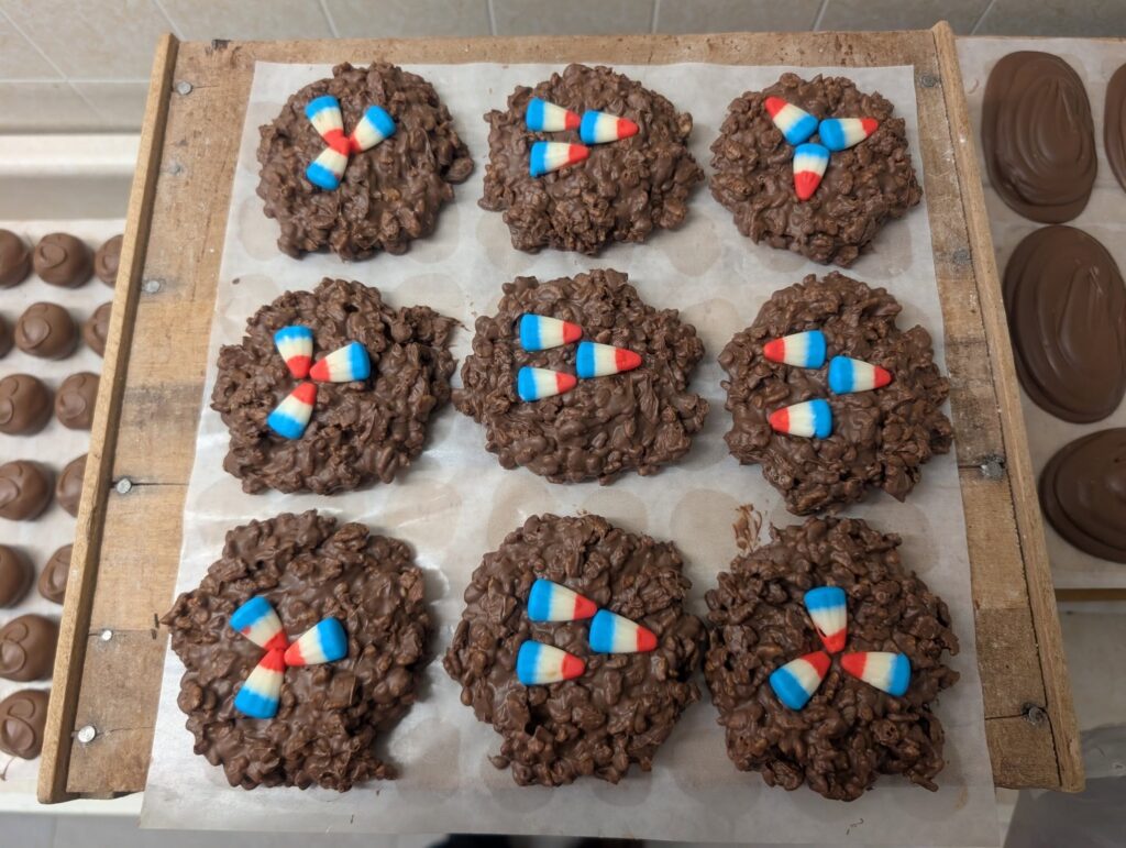 a board full of chocolate Eagles krispy nests